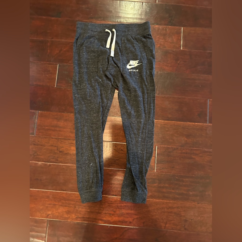 nike dark gray joggers with white drawstring and white nike logo. size medium.
